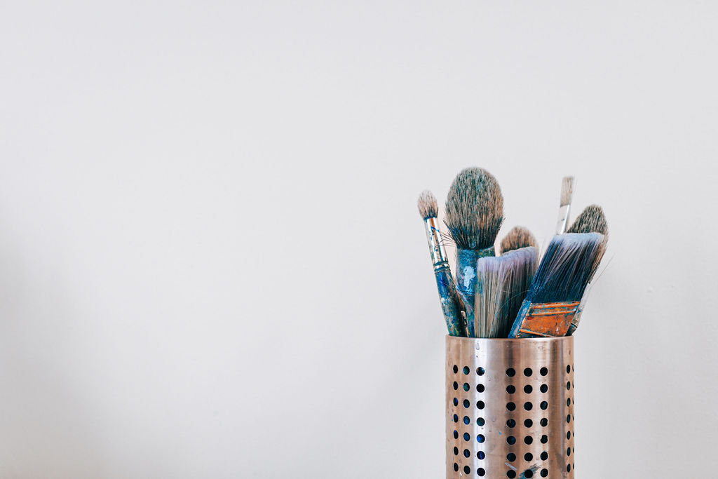 fine art paint brushes in a silver container